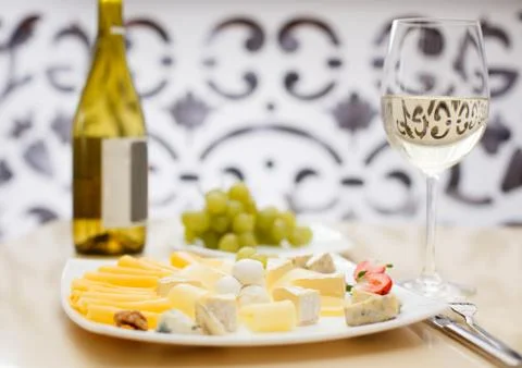 Sliced cheese with wine Stock Photos
