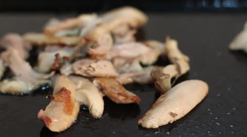 Sliced chicken meat on grill, non stick frying pan, barbeque grill. Stock Footage 68106022
