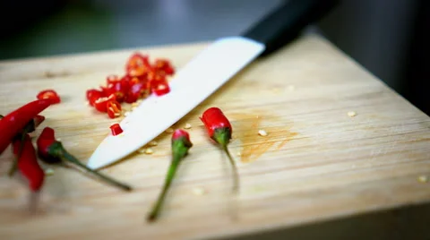 Sliced Chili on Cutting Board with White Knife - 4K Resolution Stock Footage 59785027