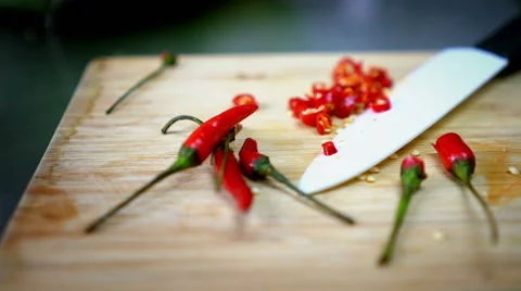 Sliced Chili on Cutting Board with White Knife 60 fps Stock Footage 59785095