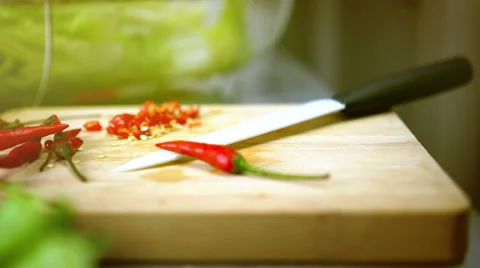 Sliced Chili Lettuce on Cutting Board with White Knife 4K Resolution Color Gr Stock Footage 59852016