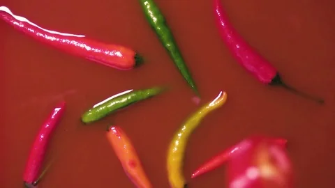 Sliced chilli pepper falling into the sauce slow motion Stock Footage 72274096