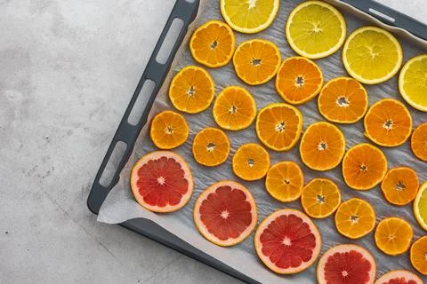 Sliced citrus on baking sheet Stock Photos