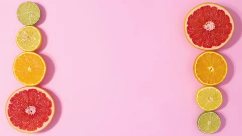 Sliced citrus range grapefruit, lemon and lime appear. Stop motion Stock Footage 152904722
