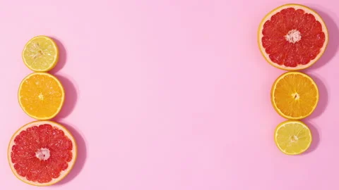Sliced citrus range grapefruit, lemon and lime appear and disappear. Stop motion Stock Footage 152905041