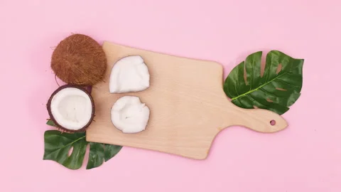 Sliced coconut appear on cutting board. Stop motion Stock Footage 147106265