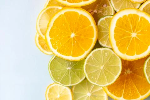 Sliced colorful juicy assorted citrus  fruits shot from above flat lay Stock Photos