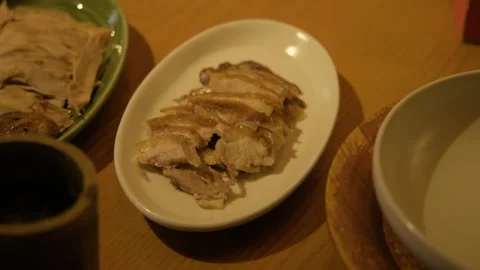 Sliced Cooked Meat on Plate in Beijing Restaurant Table Setting, China Cuisine Stock Footage 345775722
