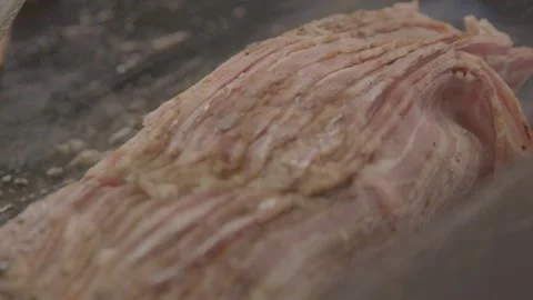 Sliced Cooked Meat Steaming on Grill at Sydney Market Food Stall Close-Up Stock Footage 345714367