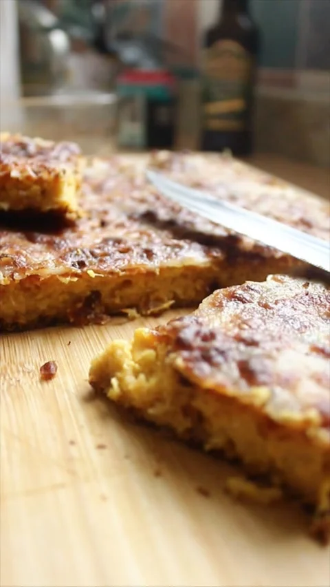 A sliced corn cake on a bamboo cutting board. Stock Footage 304005958