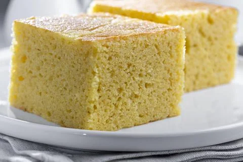 Sliced ??cornmeal cake on the table. Stock Photos