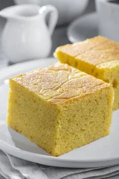 Sliced ??cornmeal cake on the table. Stock Photos