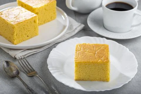 Sliced ??cornmeal cake on the table. Stock Photos