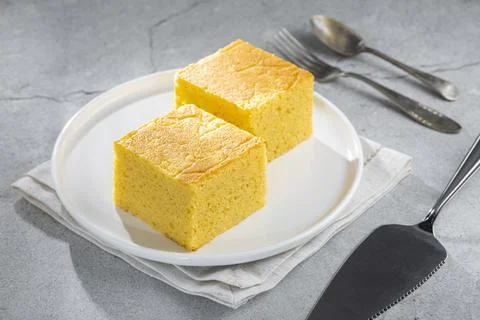 Sliced ??cornmeal cake on the table. Stock Photos