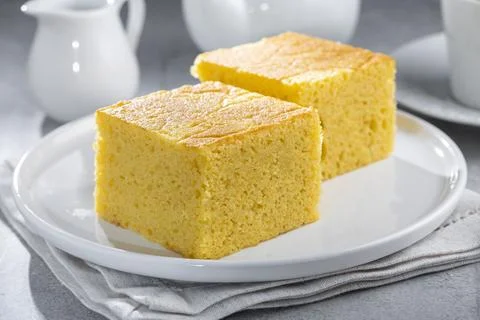 Sliced ??cornmeal cake on the table. Stock Photos