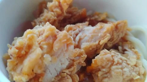 Sliced Crispy Chicken Katsu Cutlet on Top of Spaghetti Pasta Stock Footage 346116743