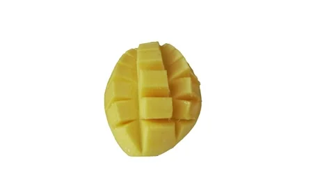 Sliced cubed mango isolated on white background and rotating. Fresh Video stock 273690073