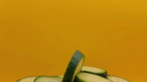 Sliced cucumber on a yellow background. Stock Footage 290870726