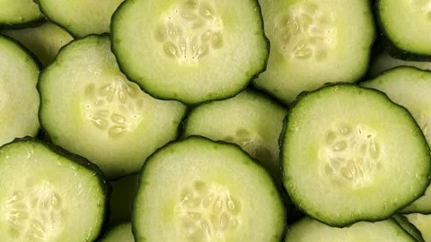 Sliced Cucumbers Background Rotation. 库存影片 276485393