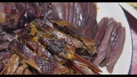 Sliced cured meat on plate, close-up, no people Video stock 329692022
