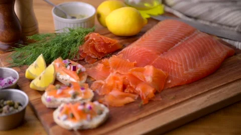 Sliced cured salmon on bread with cream cheese Stock Footage 213321836