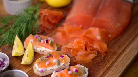 Sliced cured salmon on bread with cream cheese Stock Footage 213322526