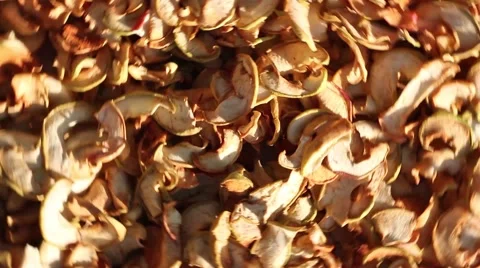 Sliced dried apples spinning on the table, closeup Video stock 54399625