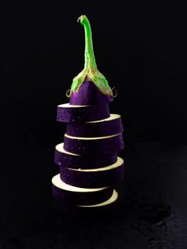 Sliced eggplant on a dark background. Stock Photos