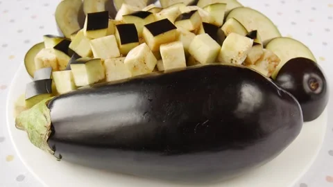 Sliced eggplant on a plate. Video stock 247607765