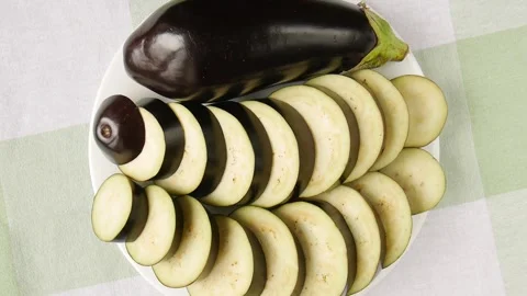 Sliced eggplant on a plate. 스톡 동영상 296878909