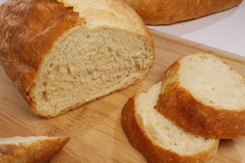 Sliced fresh bread on a cutting board Stock Photos