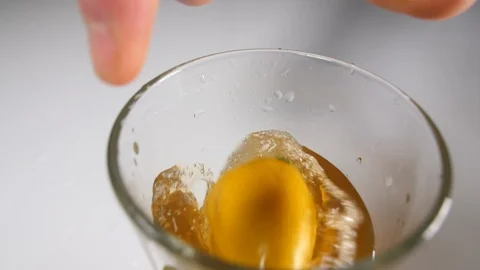 Sliced fresh lime and lemon citrus fruit with a drinking glass of iced tea Stock Footage 88510690