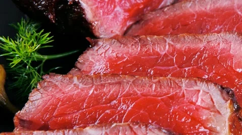 Sliced fresh meat on dark Vídeos de archivo 50415342