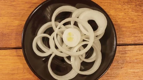 Sliced fresh onion on wooden table. Stock Footage 73752829