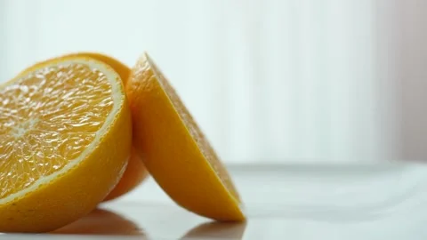 Sliced fresh orange rotating Stock Footage 160560281