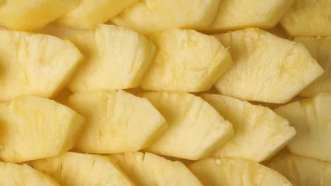 Sliced fresh pineapple pieces Stock Footage 345530583