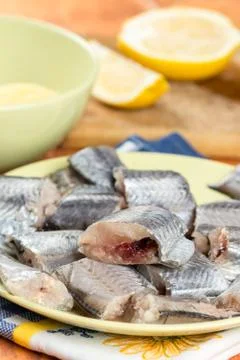 Sliced fresh raw hake fish on the green plate Stock Photos
