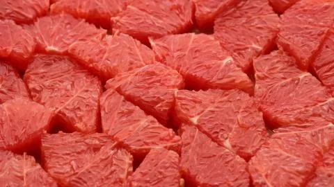 Sliced fresh red grapefruit Foto stock