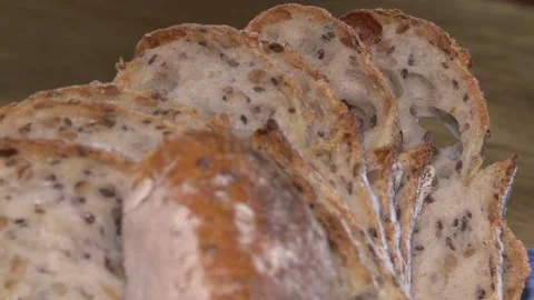 Sliced ​​fresh round bread with a beautiful crust. Video stock 113471785