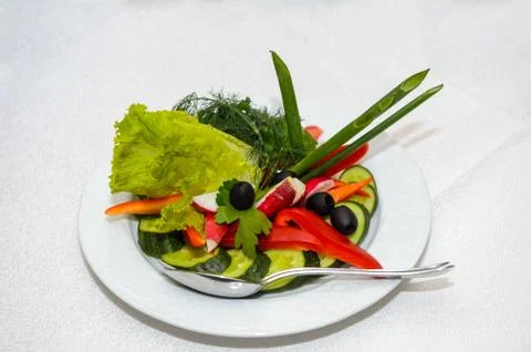Sliced fresh vegetables on a plate Stock Photos