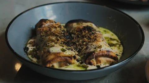 Sliced fried thin pancakes with crunch and cream sauce. Delicious French food Stock Footage 220515808