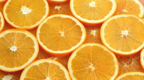 Sliced fruit orange background Stock Footage 32491278