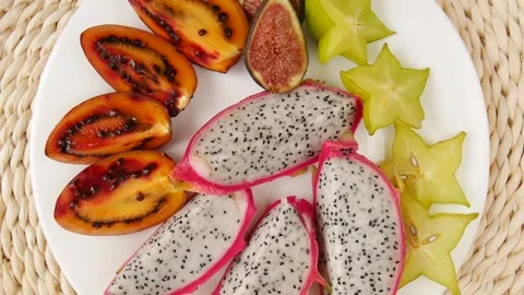 Sliced fruit on a plate. Video stock 238764739