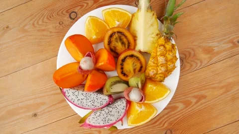 Sliced fruit on a plate. Video stock 238907675
