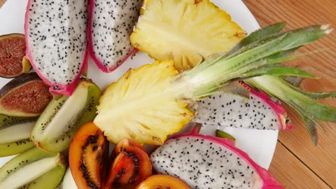 Sliced fruit on a plate. Stock Footage 239713027