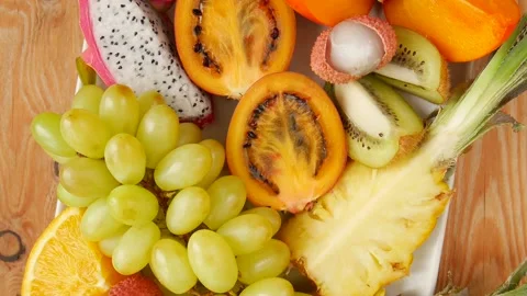 Sliced fruit on a plate. Stock Footage 239713539