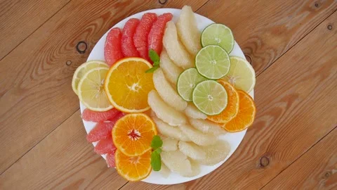 Sliced fruit on a plate. Stock Footage 241483449