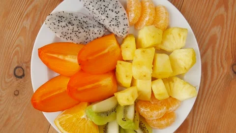 Sliced fruit on a plate. Stock Footage 243341669