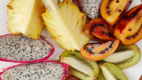 Sliced fruit on a plate. Stock Footage 243698713