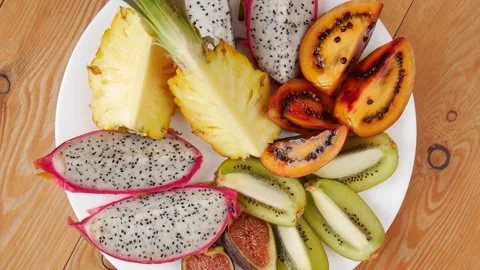 Sliced fruit on a plate. Stock Footage 243838028